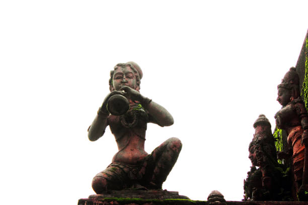 Ancient Sculpture Of A Woman Playing Music Instrument In A Temple In Amarkantak, India